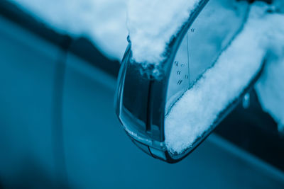 Close-up of water drop on glass