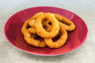 Close-up of onion rings in plate