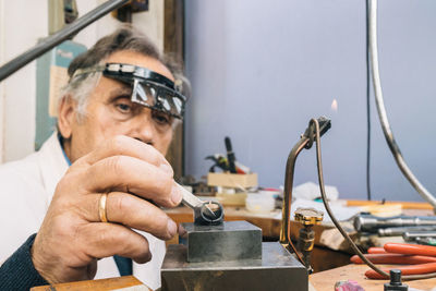 Portrait of man working in machine