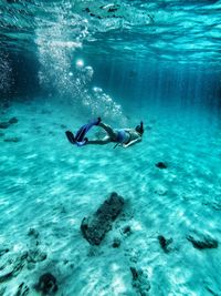 Young man swimming in sea