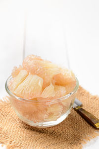 Close-up of dessert on table against white background