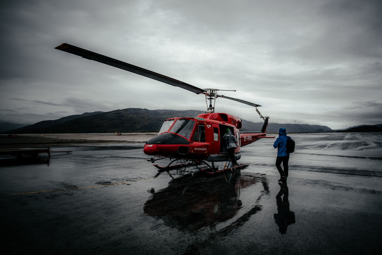 sky, cloud - sky, real people, occupation, nature, cold temperature, winter, snow, men, water, one person, working, mountain, day, standing, mode of transportation, industry, outdoors