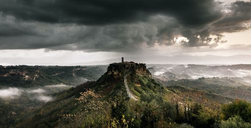 Scenic view of mountains against cloudy sky bagnoregio