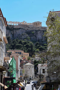 Buildings in town against clear sky