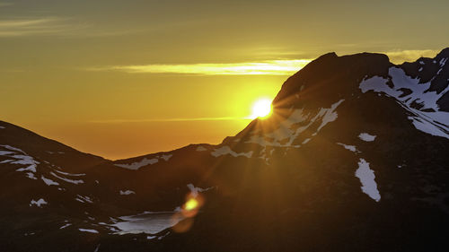 Scenic view of mountains against sky during sunset