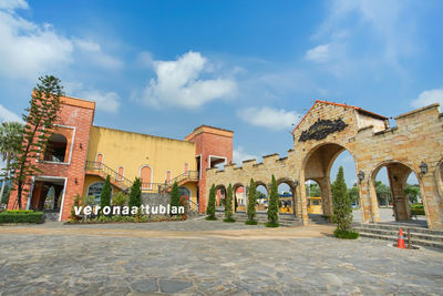 View of old building against cloudy sky