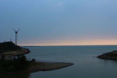 Scenic view of sea against clear sky during sunset