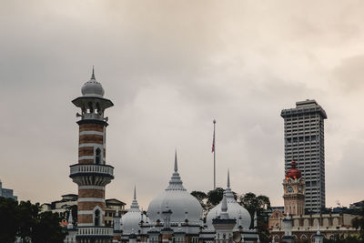 View of buildings in city against sky