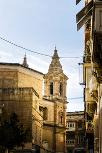 Low angle view of buildings against sky