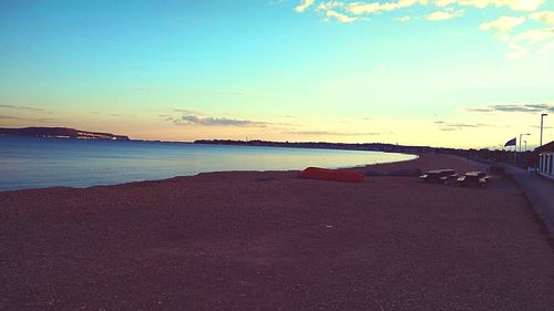 Scenic view of sea against sky at sunset