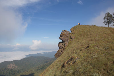 Scenic view of cliff against sky