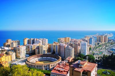 Cityscape against clear blue sky