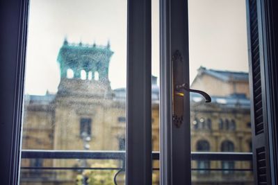 Buildings seen through glass window