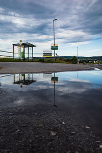 Reflection of sky on puddle