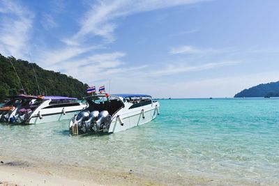 Boat parked on the sea and blue sky at surin thailand.