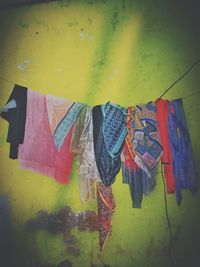 Close-up of clothes drying against wall