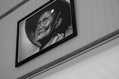 Portrait of woman with reflection on window