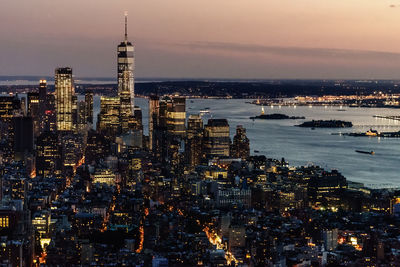 Aerial view of city lit up at night