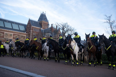 Group of people in front of buildings