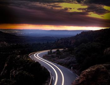 High angle view of light trails on road at night