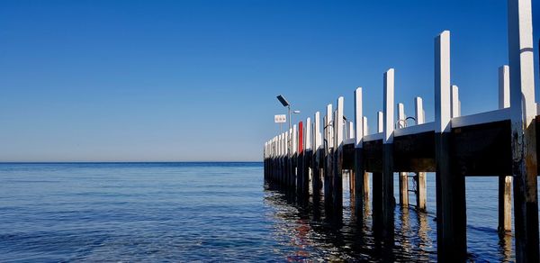 Wooden pier extending into the ocean.