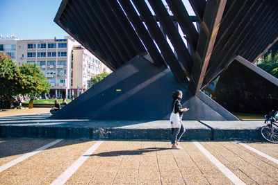 Full length of woman standing in city