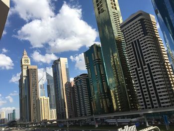 Low angle view of buildings against sky in city