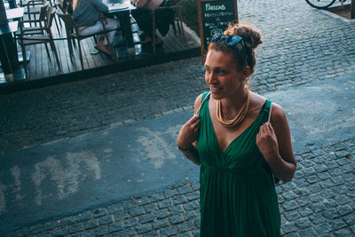 Portrait of woman standing on street