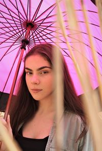 Portrait of beautiful woman with pink hair