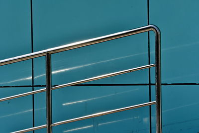 Stainless steel handrails on blue background
