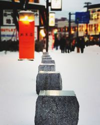 Close-up of metal structure on street in city