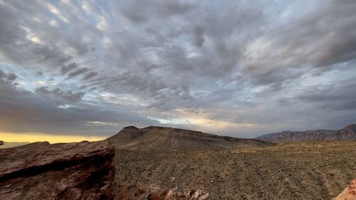 Scenic view of arid landscape against sky