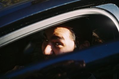 Portrait of man in car