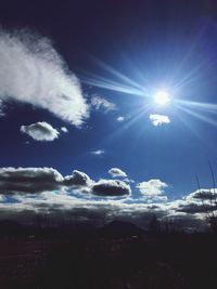 Scenic view of landscape against blue sky