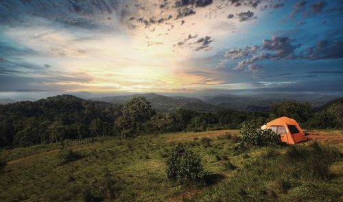 Scenic view of field against sky during sunset