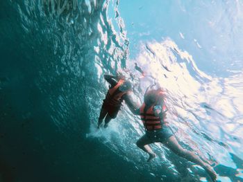 People swimming in sea