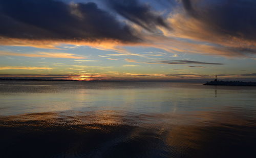 Scenic view of sea against sky at sunset