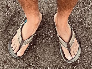 Low section of man standing on floor