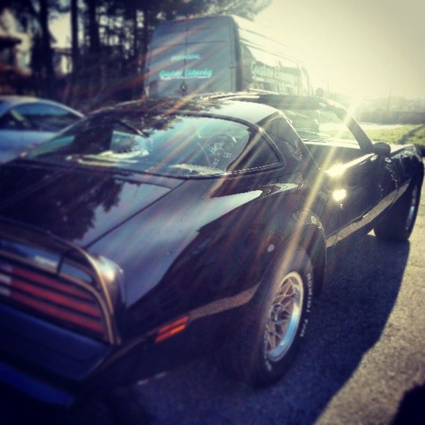 transportation, mode of transport, land vehicle, car, street, road, headlight, on the move, travel, vehicle, traffic, blurred motion, motion, windshield, tail light, outdoors, speed, stationary, part of, sky