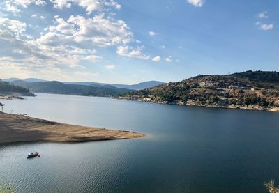 Scenic view of bay against sky