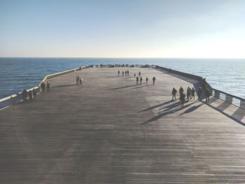 Scenic view of pier on sea against clear sky