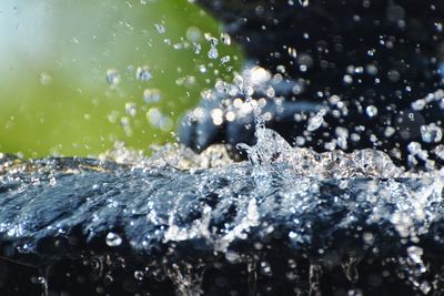 Close-up of water splashing on rocks