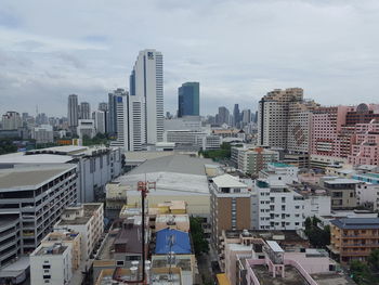 Modern buildings in city against sky