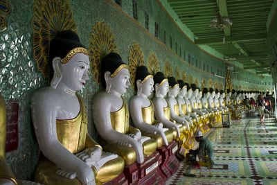 Statues in temple outside building