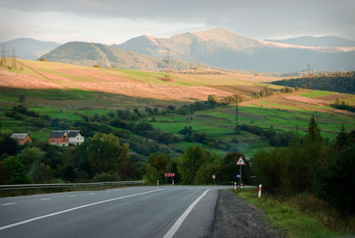 Scenic view of landscape and mountains against sky