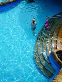 High angle view of man swimming in pool