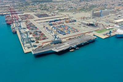 High angle view of commercial dock against blue sky