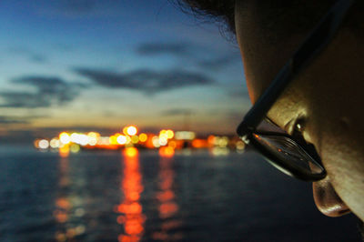 Close-up of illuminated water against sky during sunset
