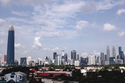 Modern buildings in city against sky