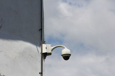 Low angle view of street light against sky